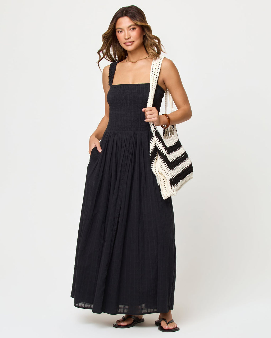 Robe longue noire en coton à smocks, larges bretelles et jupe ample