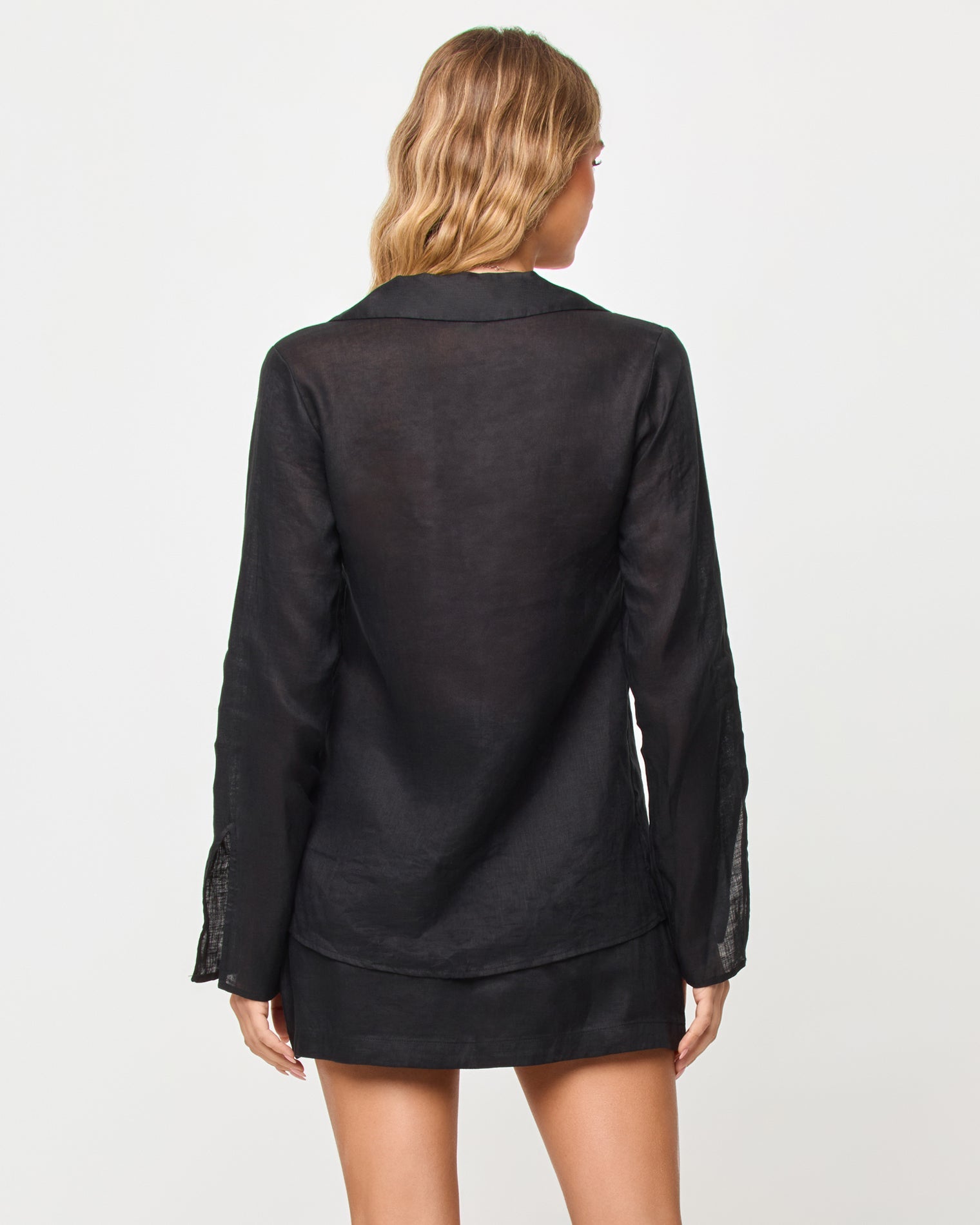 Jupe-short ajustée en lin noir avec short intégré et fermeture éclair latérale