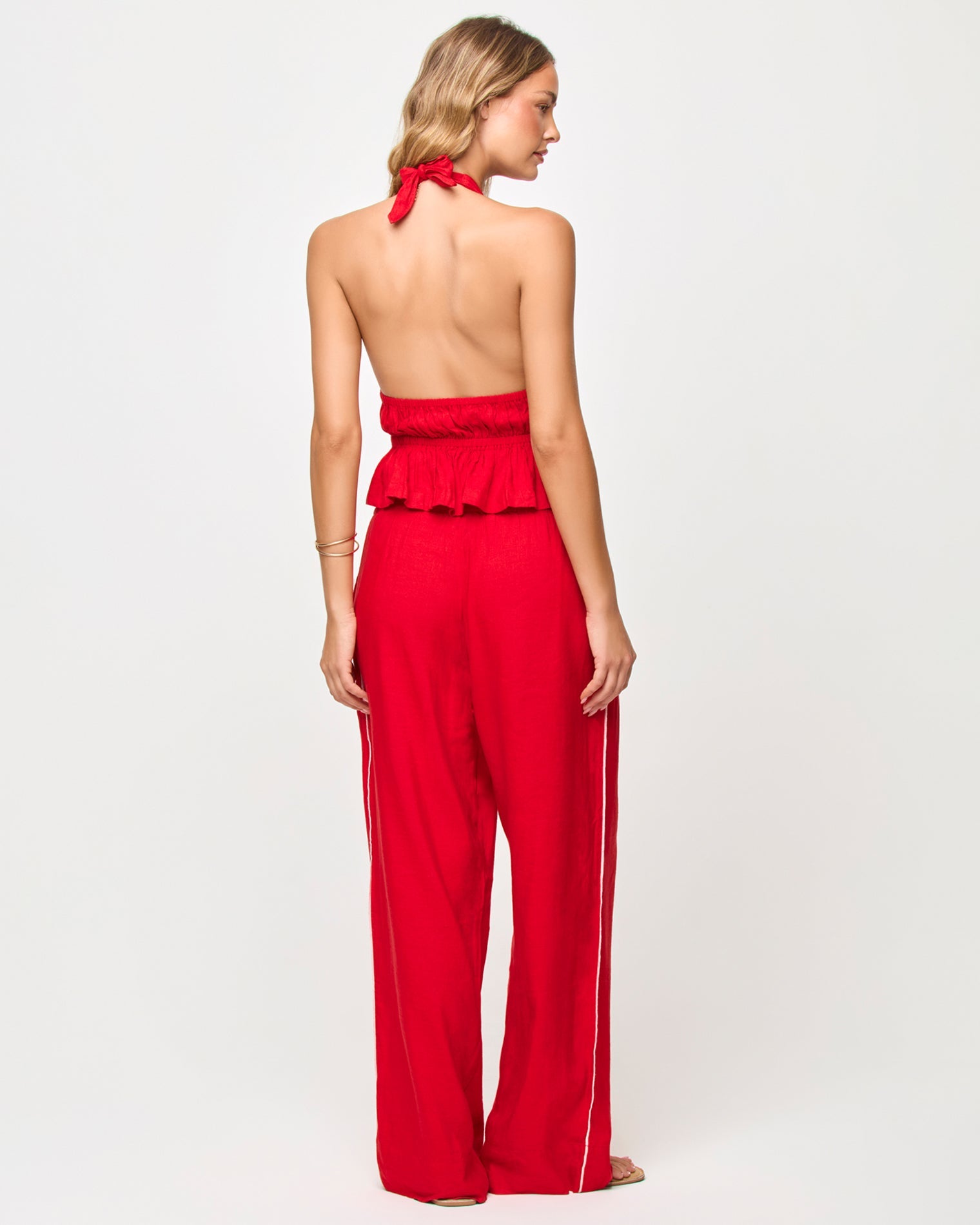 Haut péplum dos-nu Flame avec décolleté plongeant et détails à nouer